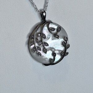 Elegant MOP pendant is stunning with its MOP base with SS/ diamond accents.